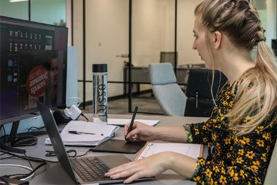 A woman working on a creative design