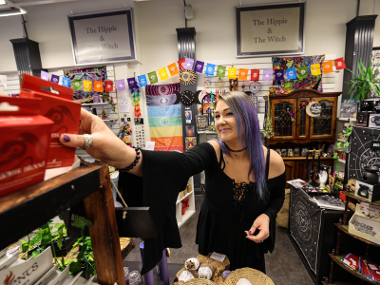 Person working in holistic, spiritual and wellbeing shop The Hippie and The Witch