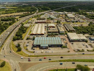 Drone image showing Portrack Lane road connections with warehouses next to a main road