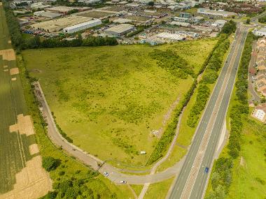 Drone image of available land at Preston Farm showing a green space