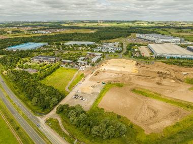 Drone image of Wynyard Business Park with buildings, green spaces and a construction area