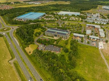 Drone image of Wynyard Business Park with warehouses and buildings next to a road