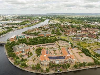 Drone image of Teesdale Business Park showing buildings along the river and Infinity Bridge